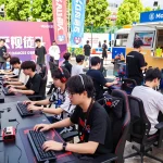 Gaming festival scene with participants enjoying mantra88 competition, vibrant outdoor atmosphere.